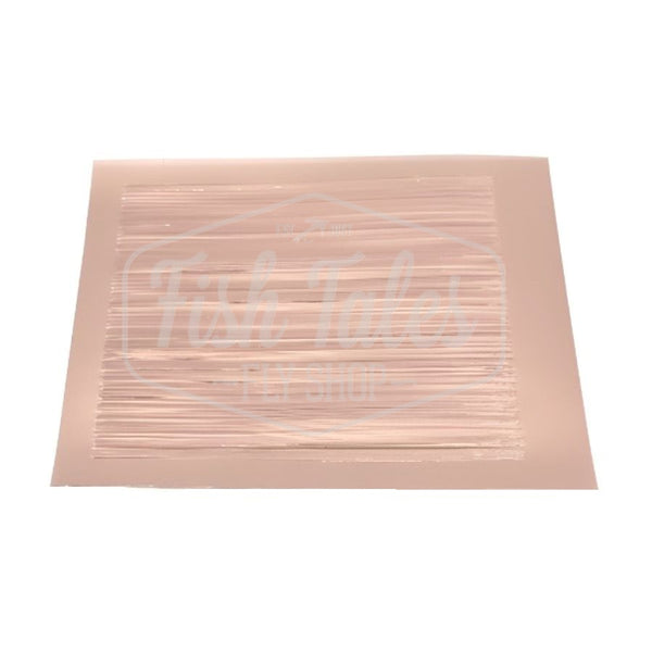 A sheet of 210Fab Chironicuts fly tying body material in bronze on a white background.