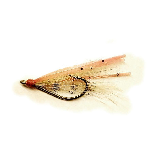 The Creeper, an unweighted bonefish fly with a barred tan wing and pink pearl sili legs, designed for targeting bonefish in sandy flats.