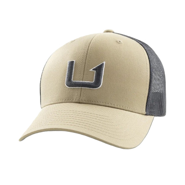 Beige and gray cap Huk Barb U Trucker Hat with a logo on a white background.