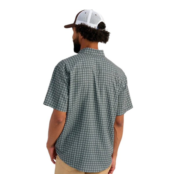 Man wearing a mini checkered print Huk Short-Sleeve Tide Point Shirt on a white background.
