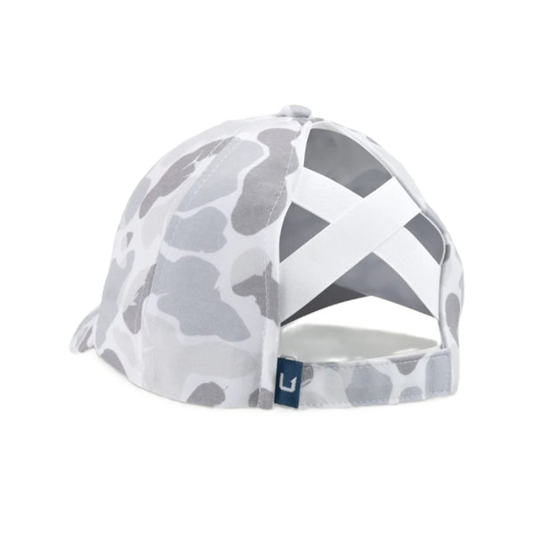 Gray camouflage Huk Women's Pony Tail Hat showing the back designed to accommodate ponytails on a white background.