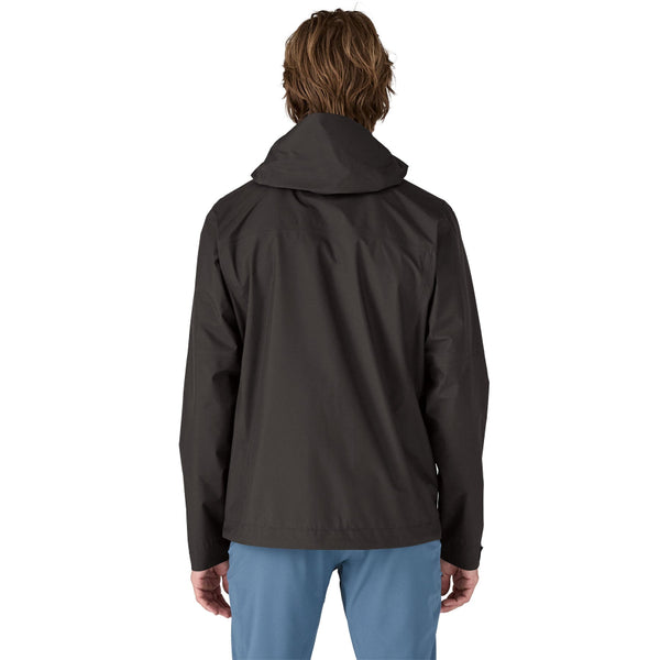 Man wearing a Patagonia Men's Boulder Fork Rain Jacket in Black on a white background.