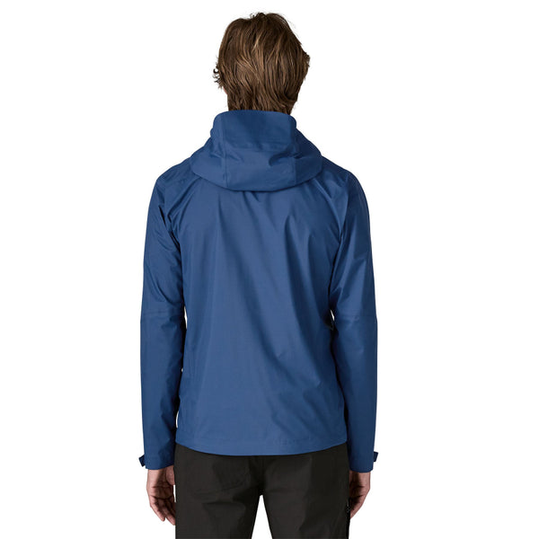 Man wearing the Patagonia Men's Granite Crest Rain Jacket in Clement Blue on a white background.