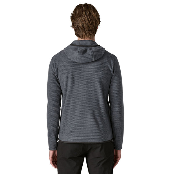 Man wearing a Smolder Blue Patagonia Men's R1 Air Fleece Hoody on a white background.