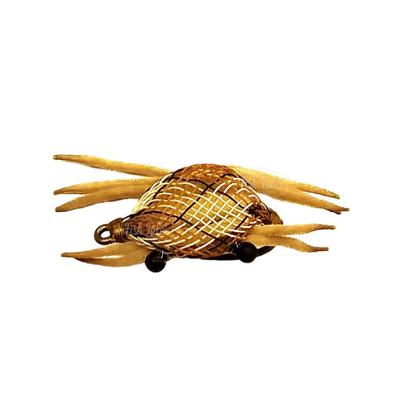 Floating Crab fly with tan and black flexo body and tan chenille legs on a white background.