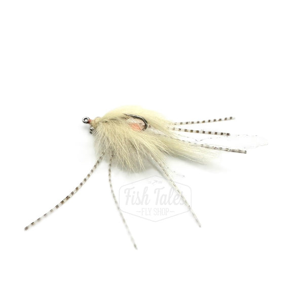 A light tan Bunny Mantis Shrimp fishing fly with barred sili legs and a rabbit hair body on a white background.