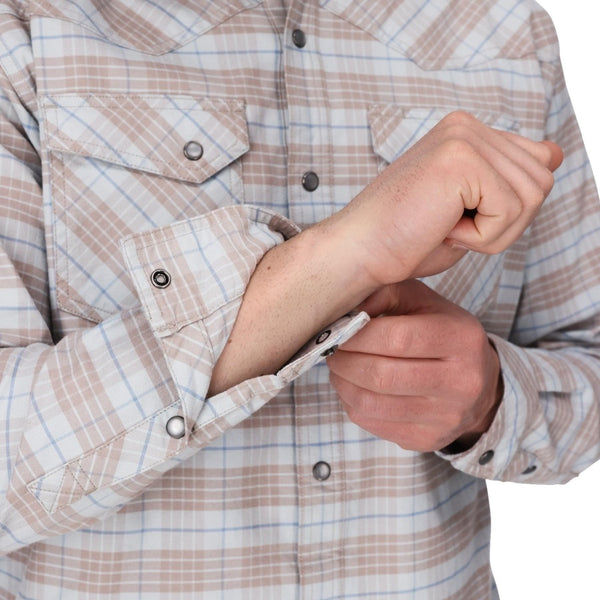 Person wearing the Simms Men's Brackett Flannel Shirt in sterling drummond plaid showing cuff detail on a white background.