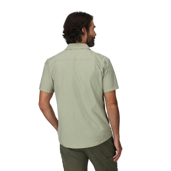 Person wearing the Simms Men's Stone Cold Short Sleeved Shirt in Fishtail Pale Pine on a white background.