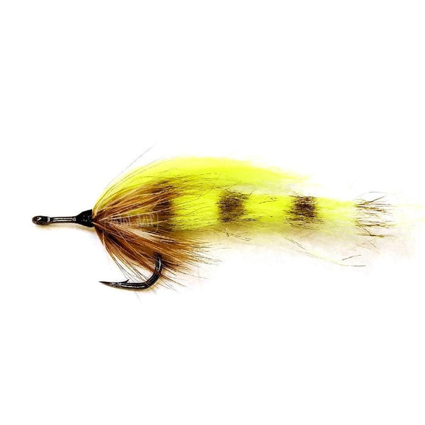 A Borski's Green Zima tarpon fly on a white background.