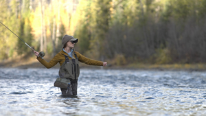 a series of five models wearing Patagonia men's and women's fishing waders  on a while background