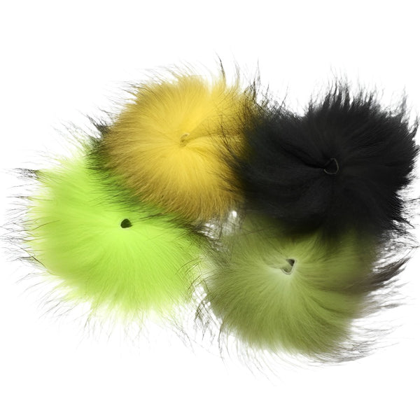 several pieces of dyed mutation fox tail fur for fly tying on white background