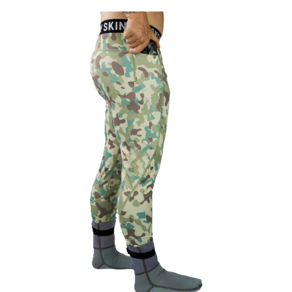 Green and tan sandstone camo Backcountry Skinz UV Compression Pants showing side drop pocket feature, on a white background.