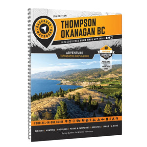 The 7th Edition Thompson Okanagan BC spiral-bound Backroad Mapbook with a large scenic lake and mountain cover photo, orange title panels, and black, white, and blue design elements on a white background.