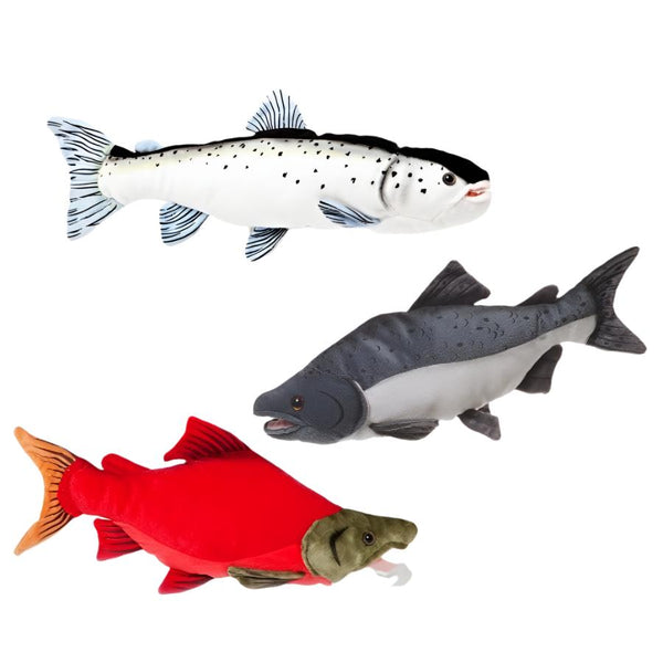 A collection of realistic stuffed salmon toys in various colors, including white, gray, and red, designed to resemble different species of salmon, on a white background.