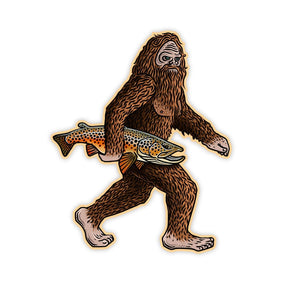 Casey Underwood Brown Squatch decal showing an illustration of a Sasquatch holding a brown trout on a white background.