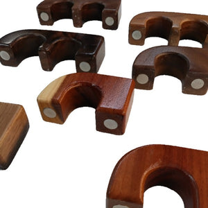 assorted single and double docs exotic wood magnetic rod holders on white background
