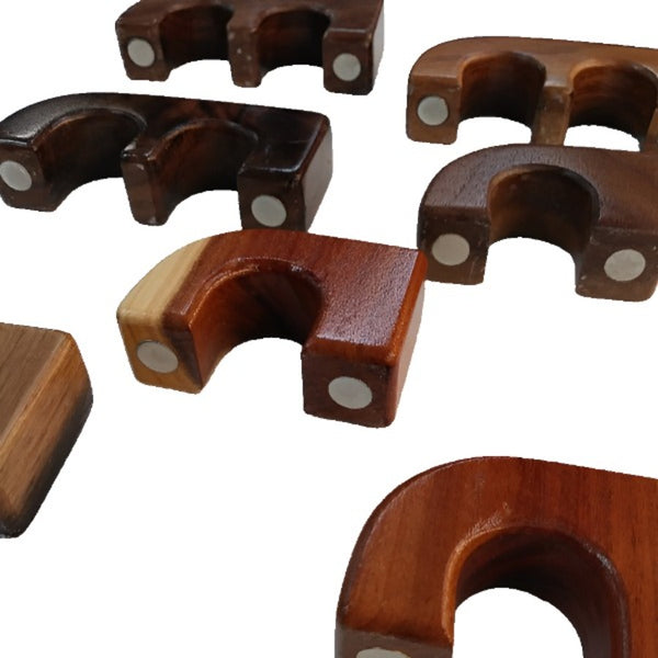 assorted single and double docs exotic wood magnetic rod holders on white background