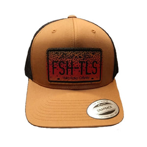 Tan and black trucker cap with a black patch featuring cutthroat trout 'Fish Tales Fly Shop' Alberta license plate logo patch, on a white background.