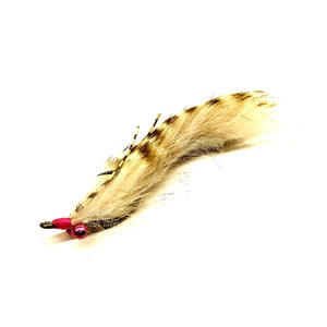An x-large barred tan Cayo Coco Loco saltwater flats fly with pink accents and bead chain eyes on a white background.