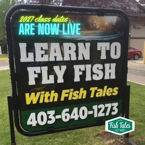 Outdoor sign on a grassy boulevard featuring  the words 