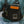 Person in blue clothing wearing Fishpond Stormshadow Chest Pack Waxed Cotton in duskwood color.