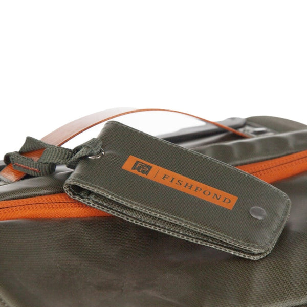 Green Fishpond Stormshadow Luggage Tag attached to a pack made from the same material on a white background.