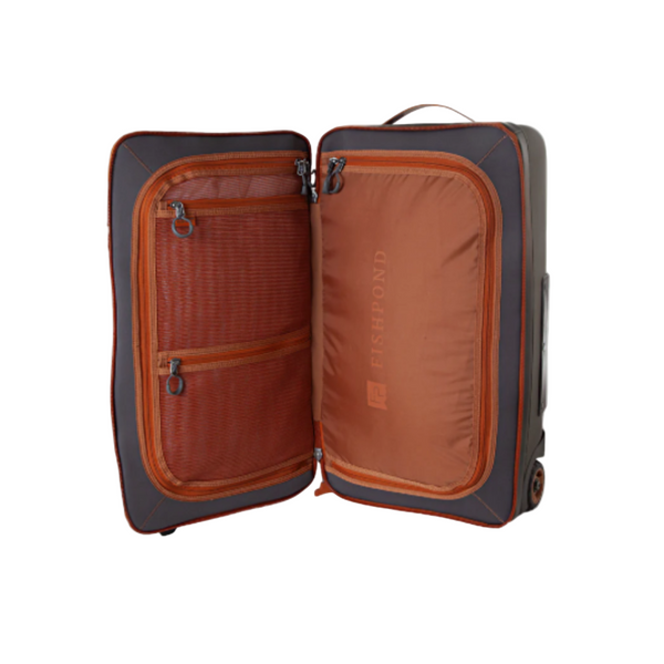 Open green Fishpond Stormshadow Rolling Carry-On Duffel with orange interior compartments on a white background.