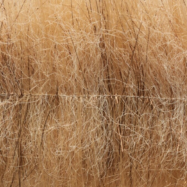 Dirty tan color Fulling Mill Flashy Craft Brush fly tying material, close up.