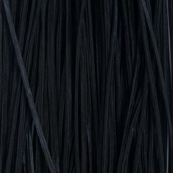 Close up of strands of Fulling Mill Flex Floss in black used for fly tying on a white background.