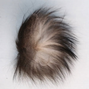 tuft of gaspe fly co silver fox tail fur on white background