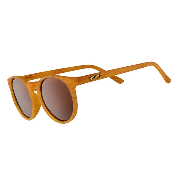 Wood patterned Goodr Circle G Bodhi's Ultimate Ride sunglasses with brown lenses on a white background.