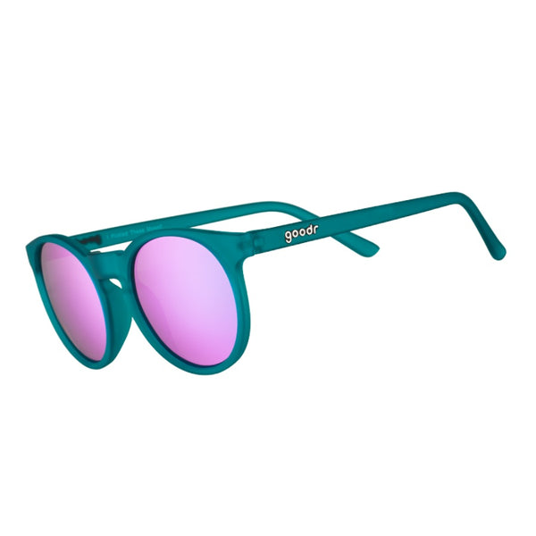 Teal framed Goodr Circle G I Pickled These Myself Sunglasses with lilac lenses on a white background.