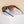 Goodr Flex G Lawn Mower Drag Race Sunglasses with green frame and brown gradient lens on a neutral background.