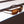 Goodr Grand G Sunglasses with tortoiseshell frame and brown lenses on a shadowed surface.