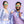 Two people wearing pair of lilac purple Goodr OG sunglasses with purple suits on a purple background.