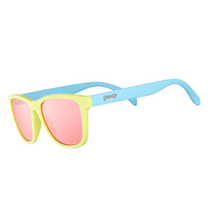 Goodr OG Sunglasses with blue and yellow frame and pink lenses on a white background.