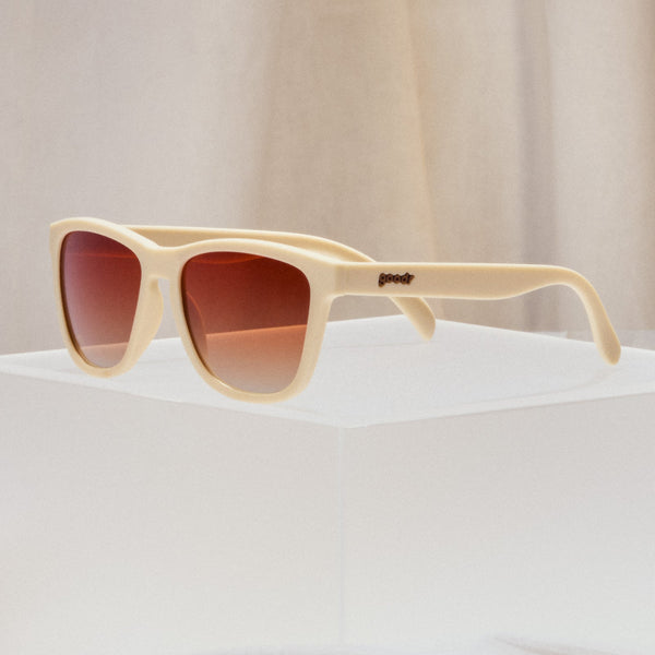 Beige Goodr OG Toasted Marshmallow Magic sunglasses with brown gradient lenses on a neutral background.