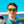 Person wearingBlack Goodr OG Vincent's Absinthe Night Terrors sunglasses with a soccer ball in front of a goalpost.