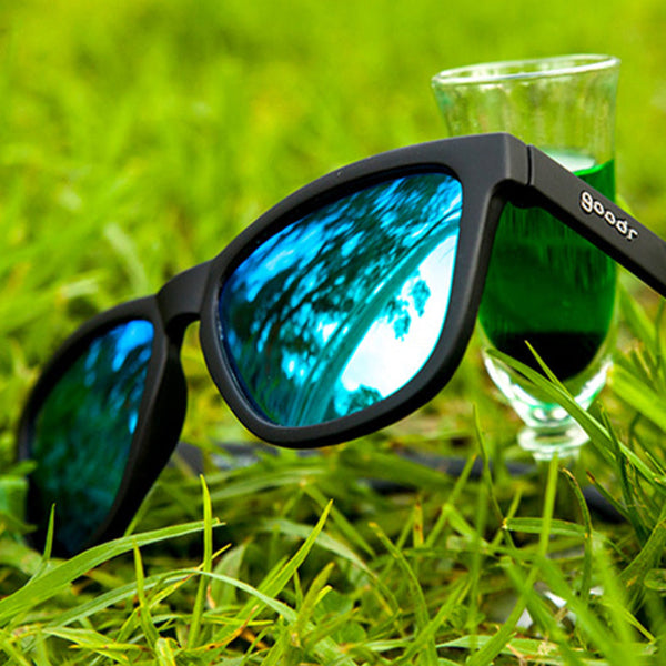 Black Goodr OG Vincent's Absinthe Night Terrors sunglasses on a grassy background.