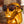 Gold statue wearing Goodr PHG Sunglasses with tortoiseshell frame and brown lenses on a blurred background.