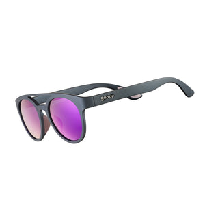 Goodr PHG Sunglasses with pink lenses and dark grey frame on a white background.