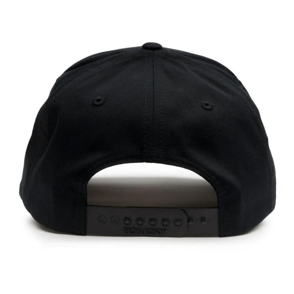Back view of the Grundens Fish Bones Trucker Hat in black showing cloth back and adjustable snap strap, on a white background.