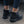 Person wearing the Grundens Women's Deviation Sherpa Ankle Boot in black on pavement.