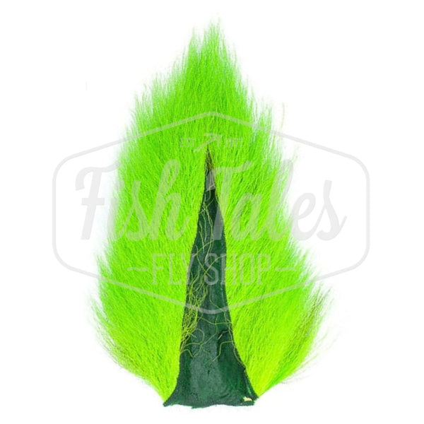 A fluorescent chartreuse dyed Hook and Hackle Whole Bucktail for fly tying shown from the underside, on a white background with the Fish Tales logo watermark.