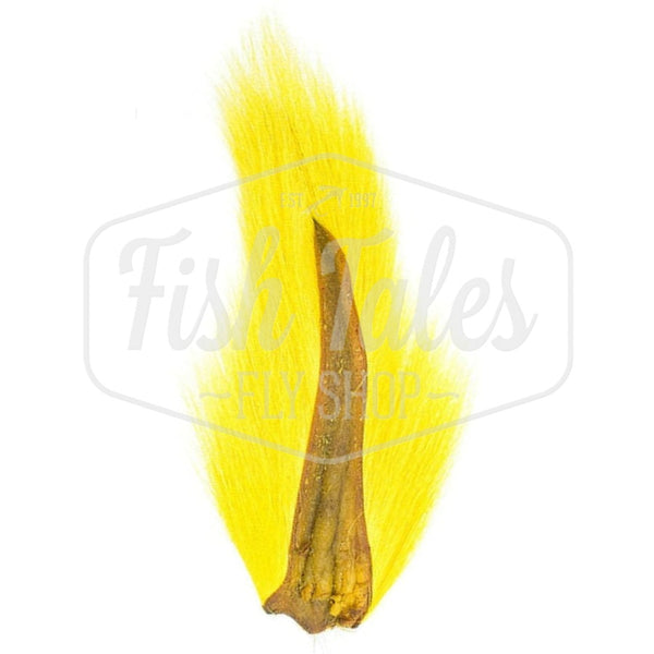 A yellow dyed Hook and Hackle Whole Bucktail for fly tying shown from the underside, on a white background with the Fish Tales logo watermark.