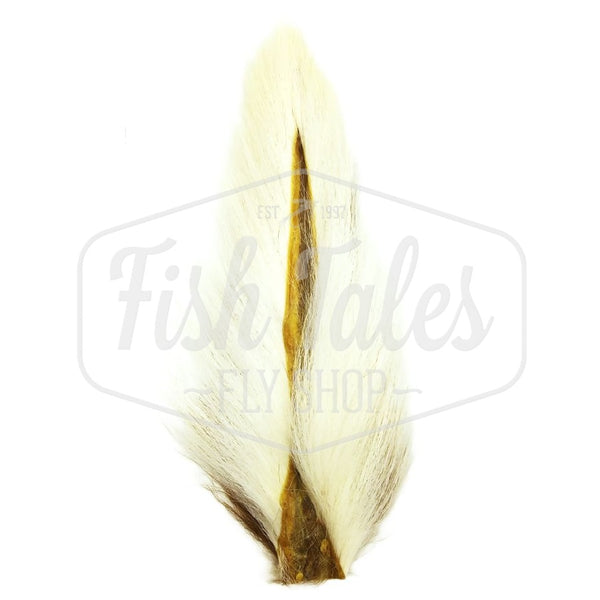 A natural white and brown Hook and Hackle Whole Bucktail for fly tying shown from the underside, on a white background with the Fish Tales logo watermark.