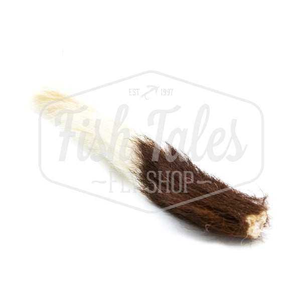 Natural white whole Hook and Hackle calf tail for fly tying, on a white background.