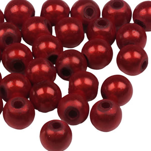 a group of red beads for fly tying