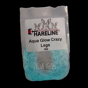 package of glow in the dark hareline aqua glow crazy legs on dark background