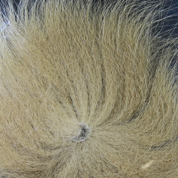 Close up of dyed tan arctic fox tail fur used for fly tying.